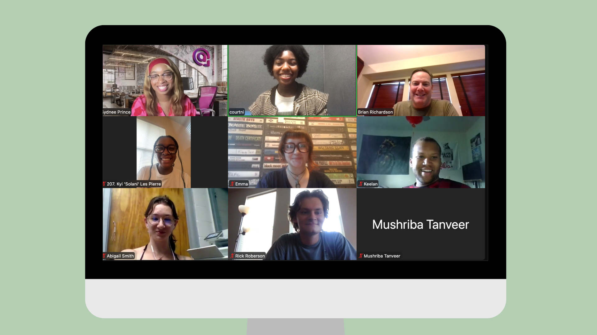 Screenshot of virtual COMM Future Pros meeting with guest Sydnee Prince and members. The screenshot is placed on a graphic of a large desktop monitor.