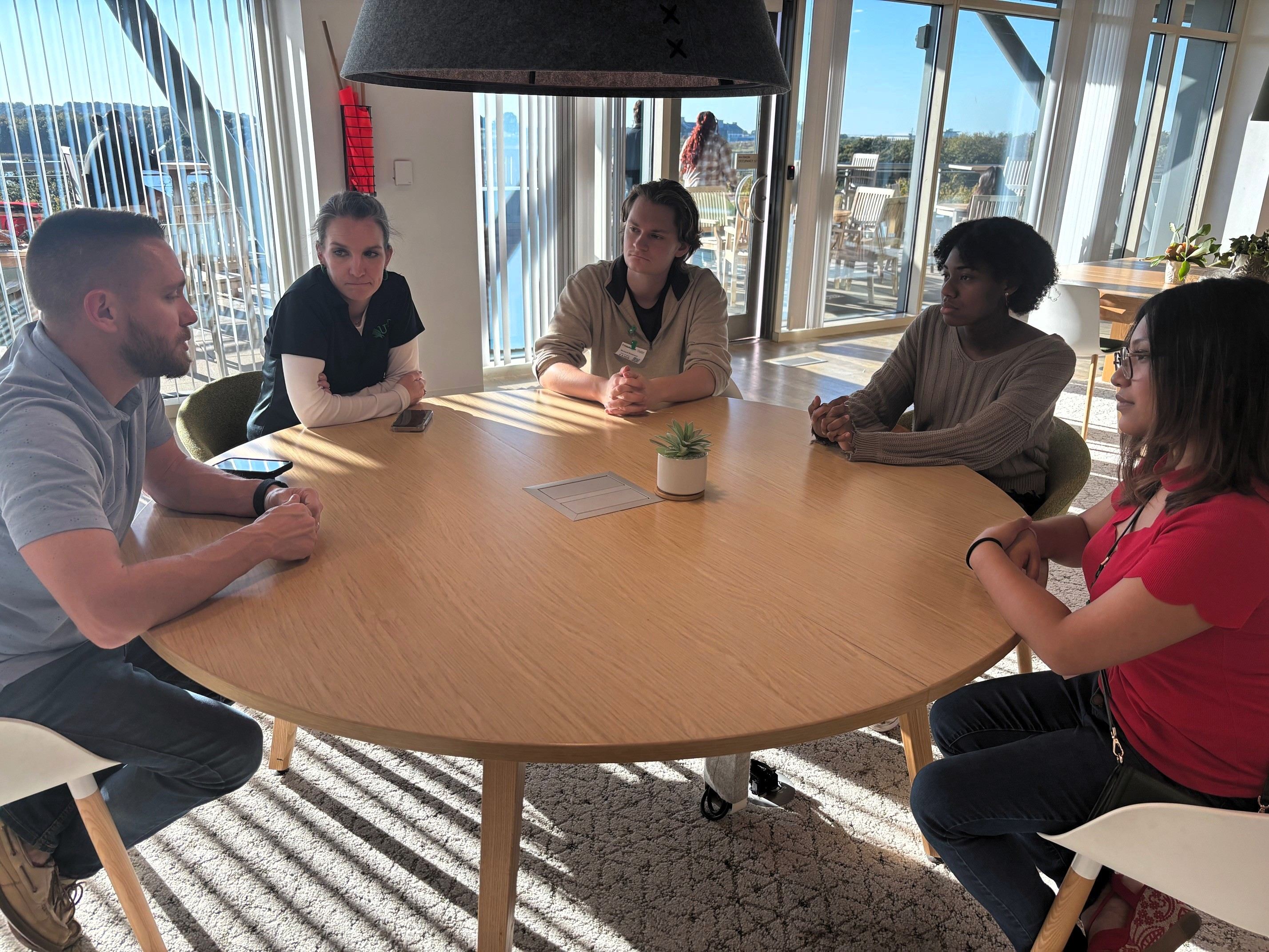 COMM Future Pros meeting with fidelity employees at table