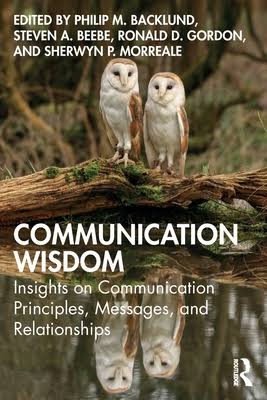Book cover of Communication Wisdom featuring two owls reflected in a pond