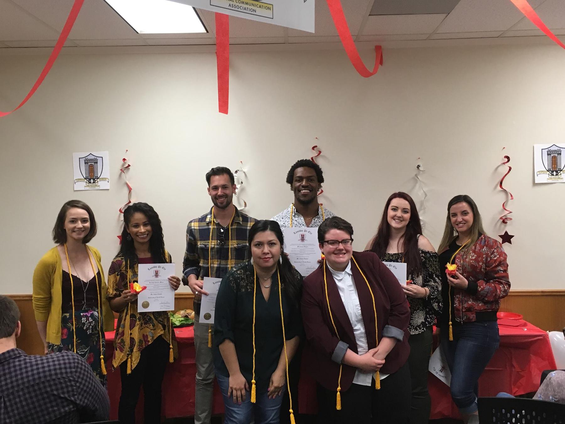 Lambda Pie Eta members showing their new cords