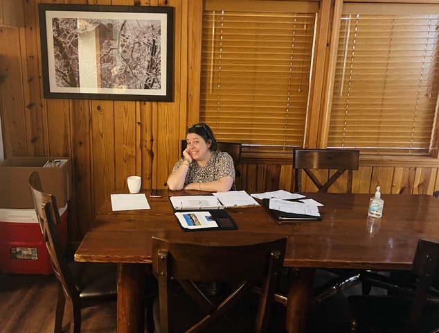 Dr. Holley Vaughn at a table grinning