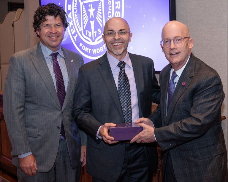 Dr. Paul Schrodt receiving his award