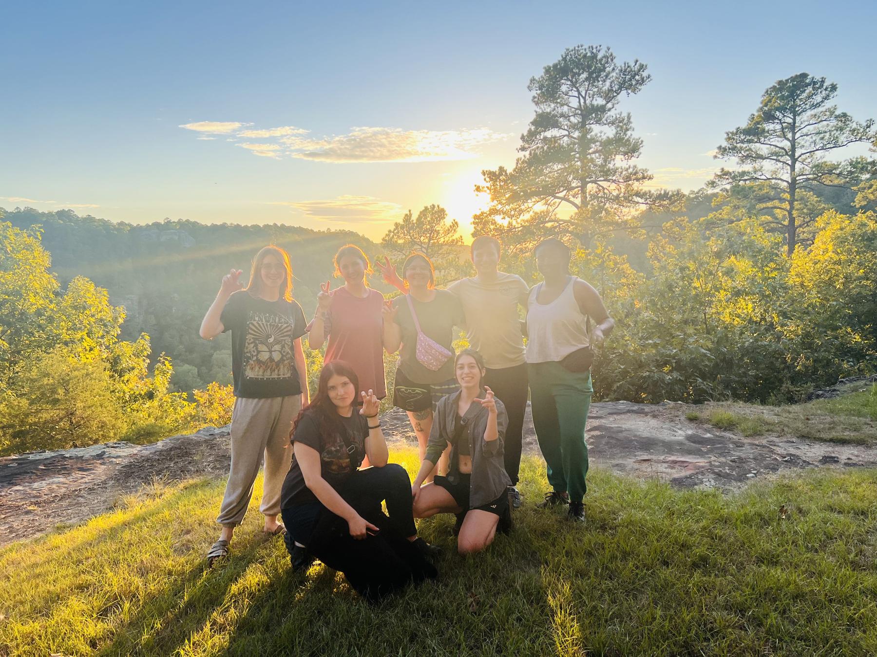 Image of UNT Performance Students on the mountain at Petit Jean State Park, displaying the UNT claw