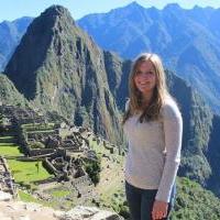 Student Laura Maninger in travel photo posing in front of Macu Picchu in Peru