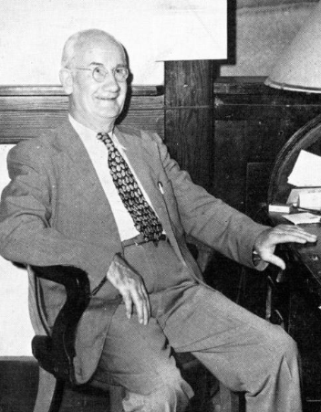 Dr. Kingbury sitting in a chair posing for a photograph in 1948.