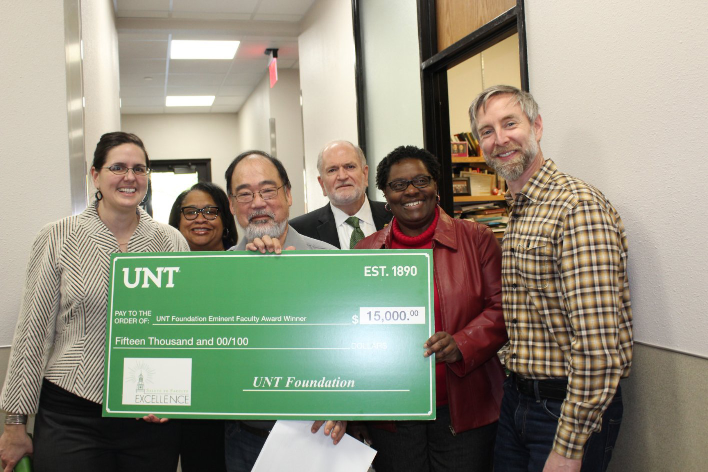 Photo with John Ishiyama, the Provost, the Dean, and the Chair of the department with a large check