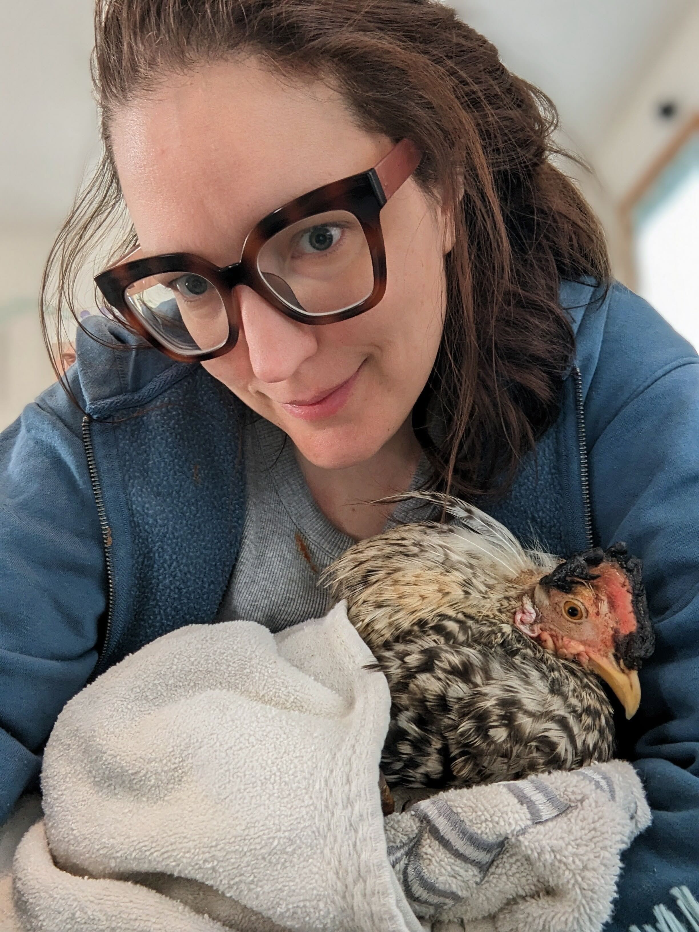 Woman holds a rooster