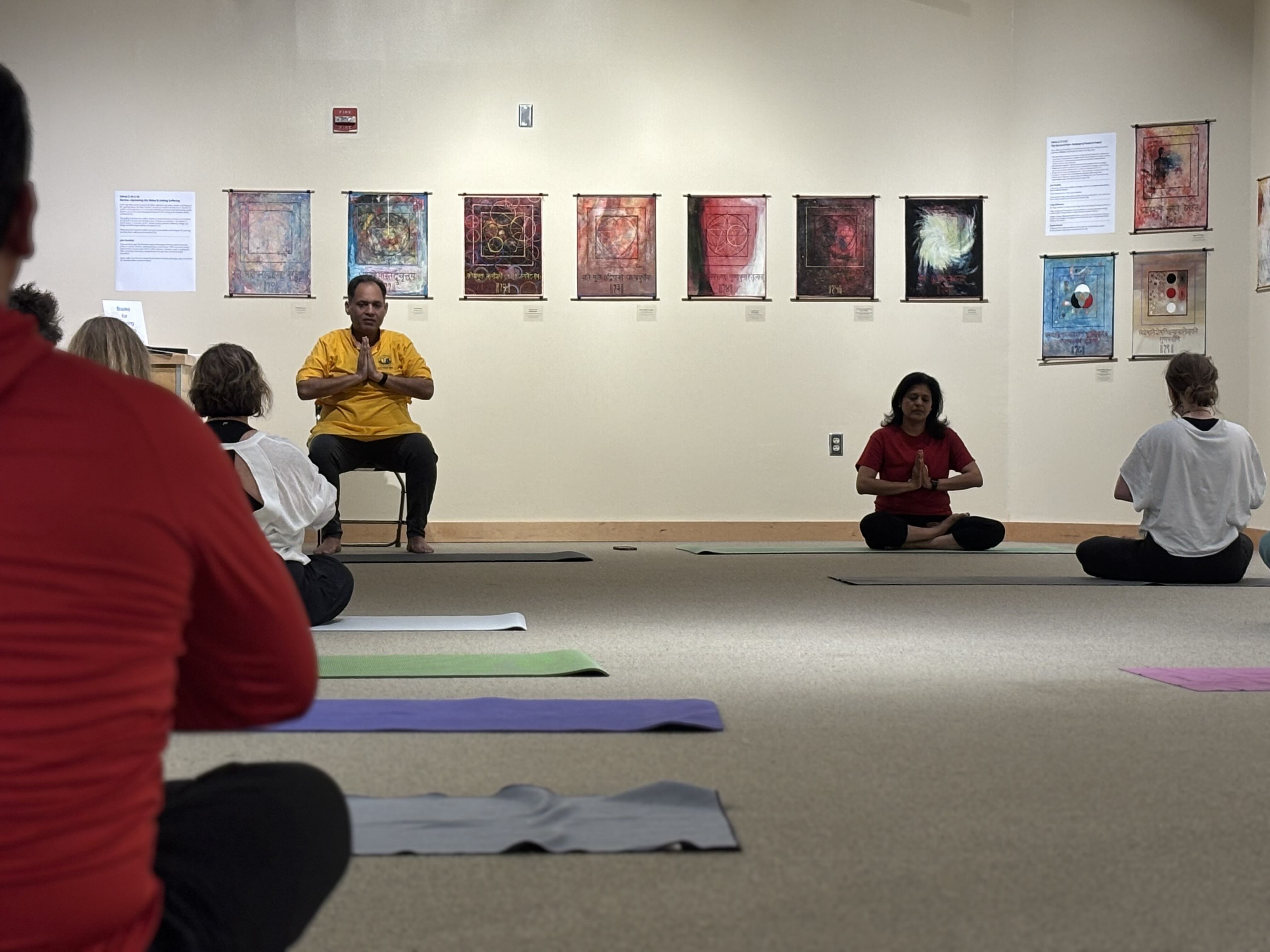 People seated for yoga class