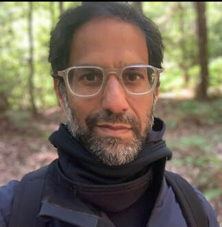 Image of a man in a scarf