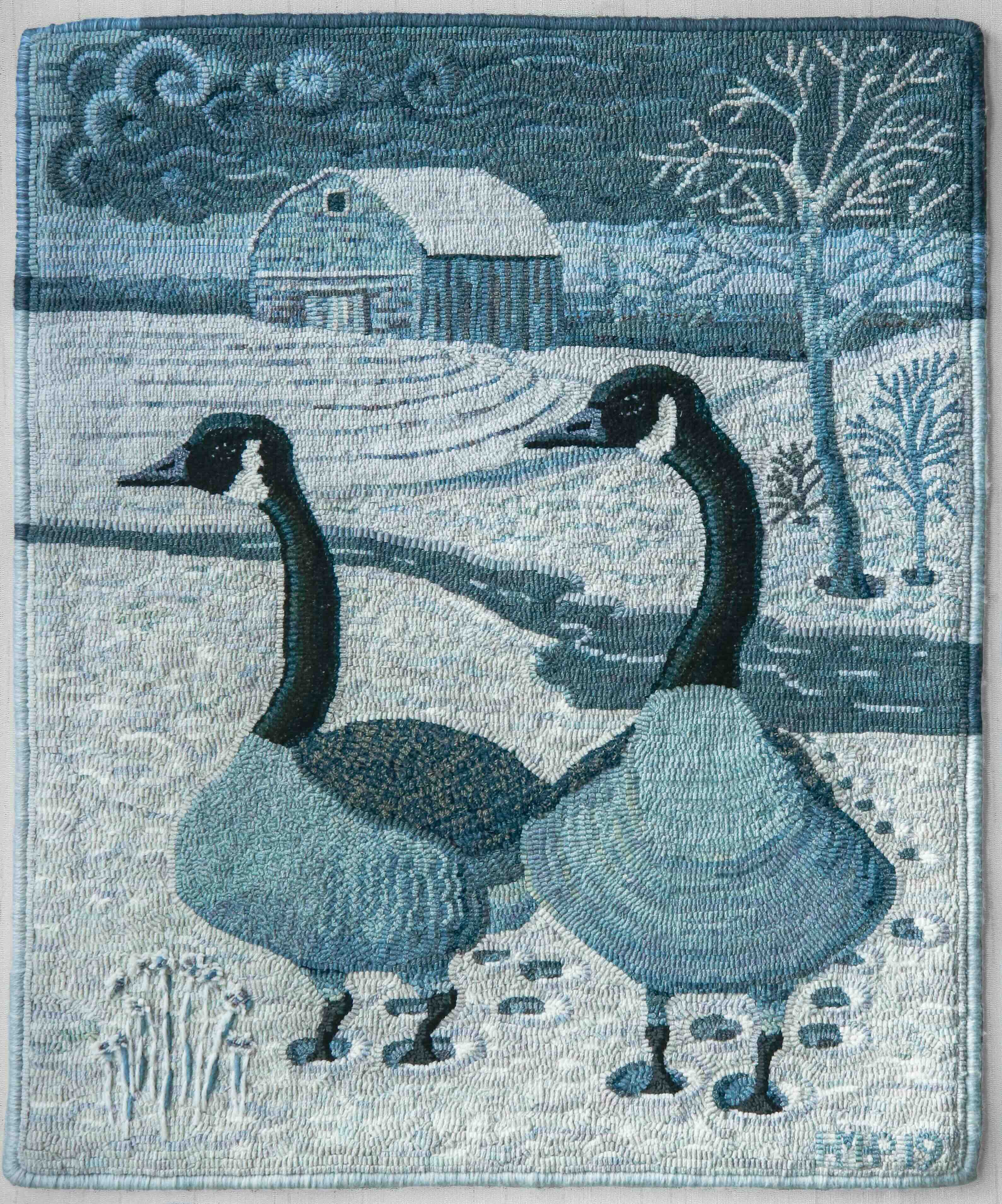 A hooked rug depicting two geese.
