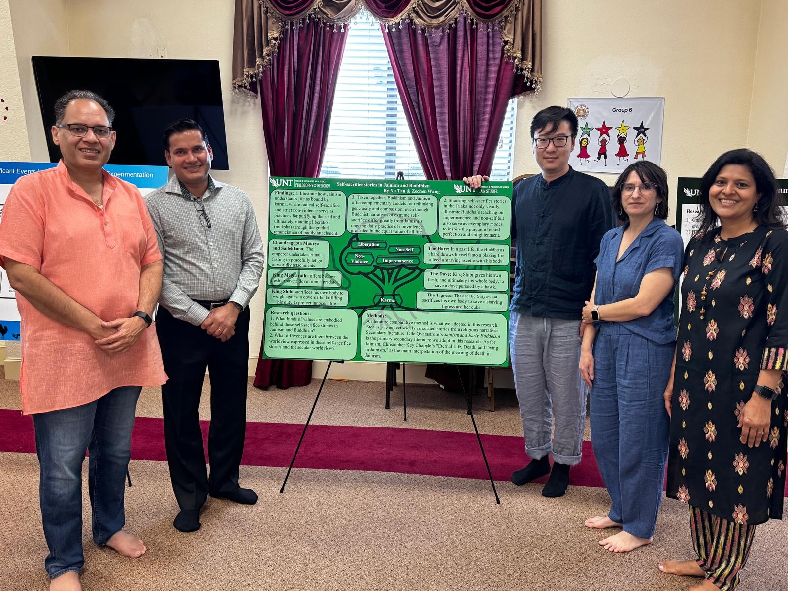 People stand in a semicircle around a poster.