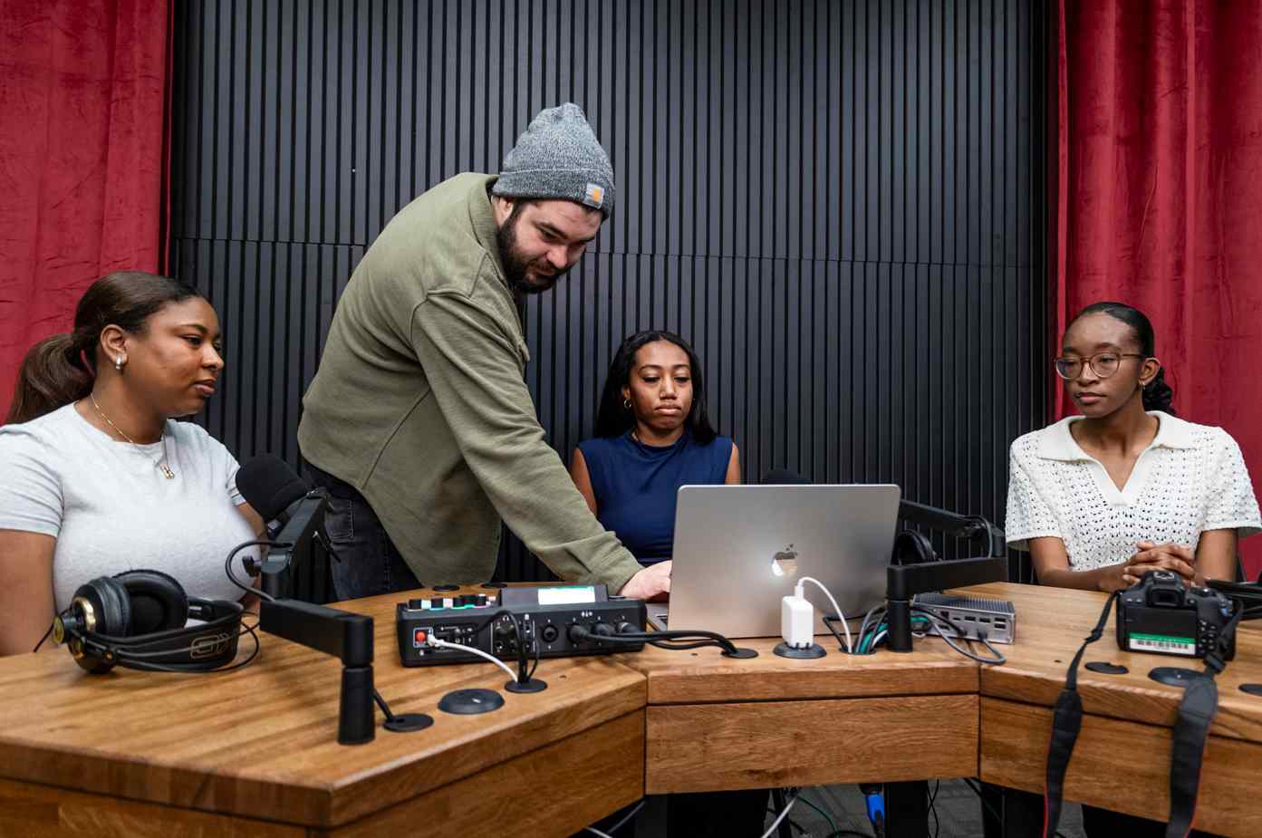 NTDaily students working on a story in a shared workspace