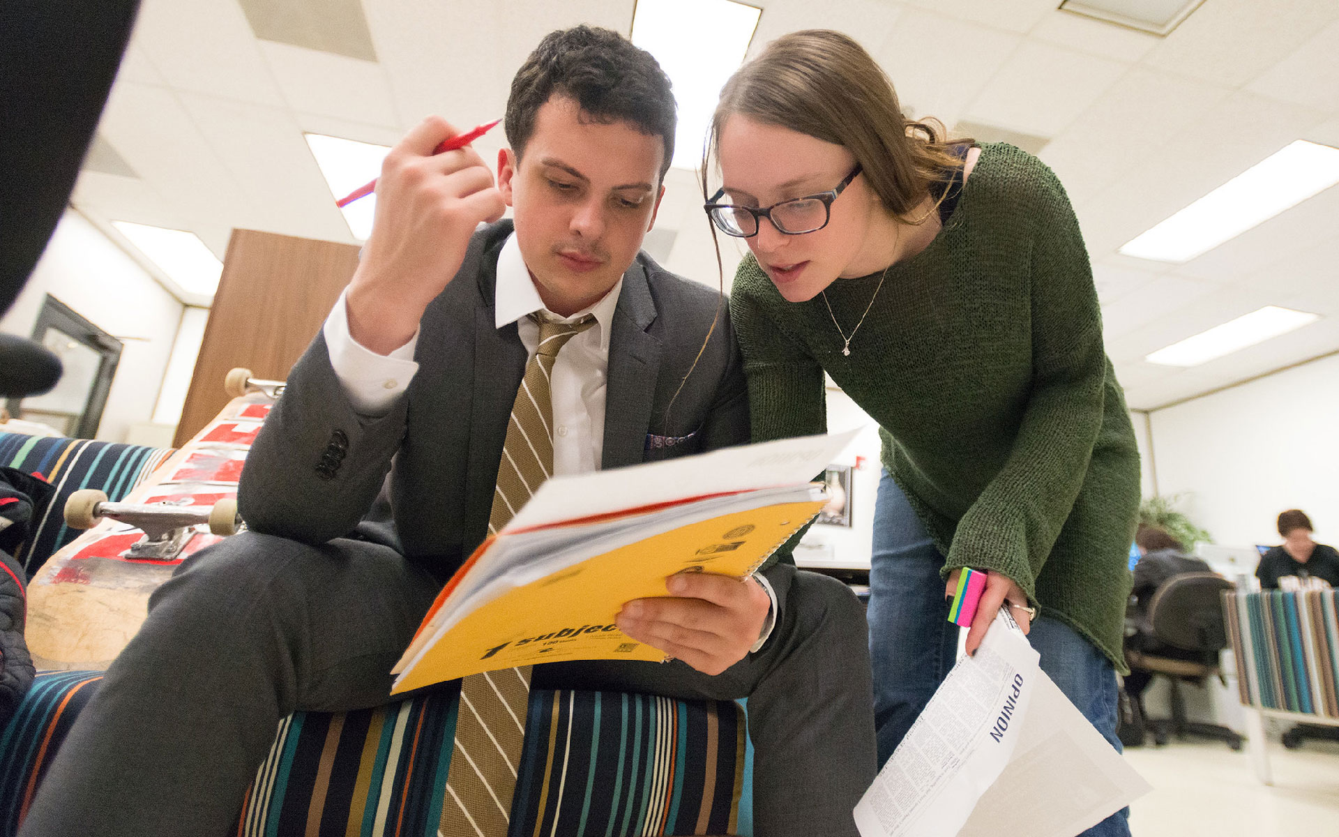 NTDaily students working on a story in a shared workspace