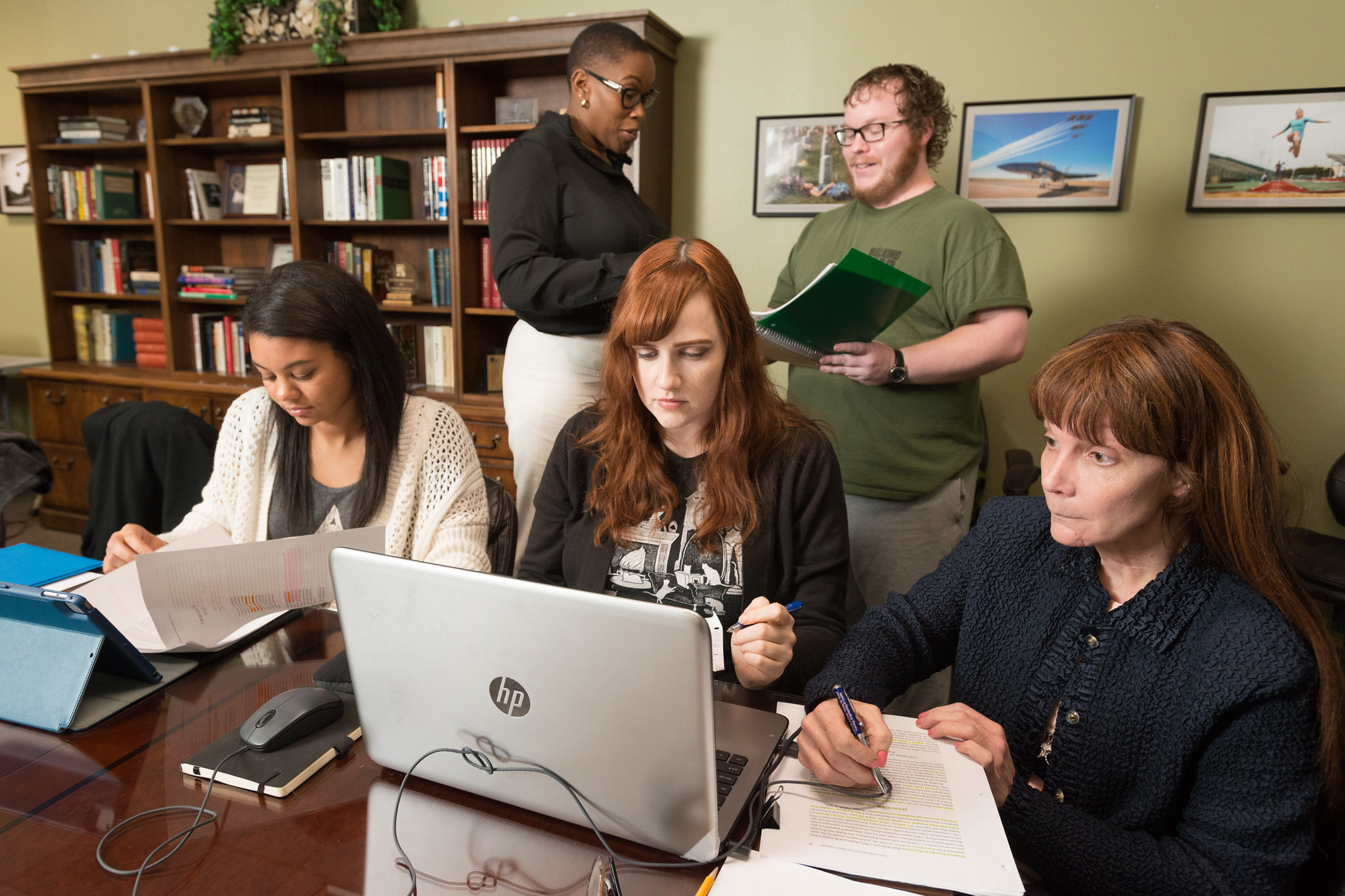 students in classroom having conversations with instructor