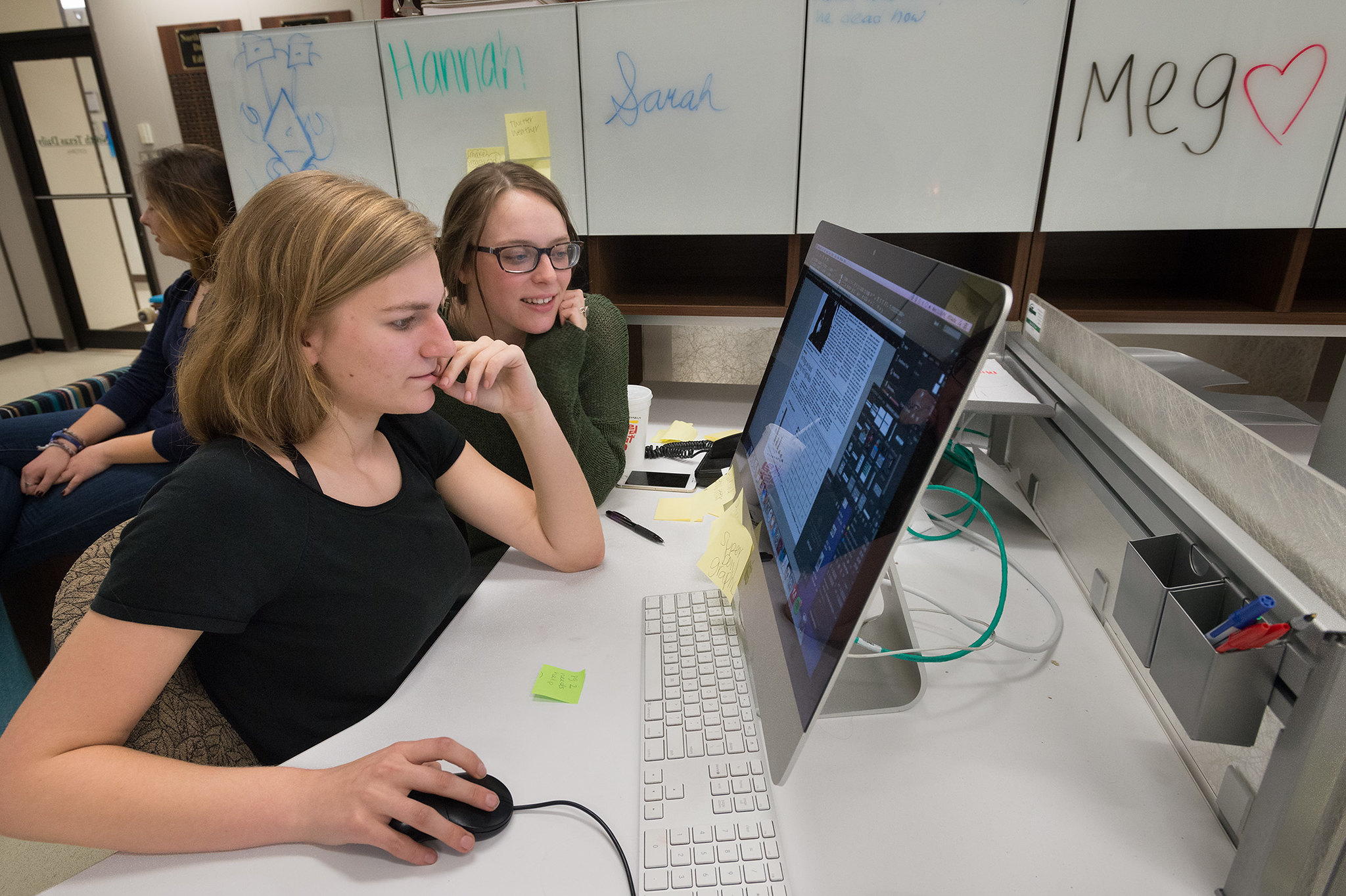 students looking at computer