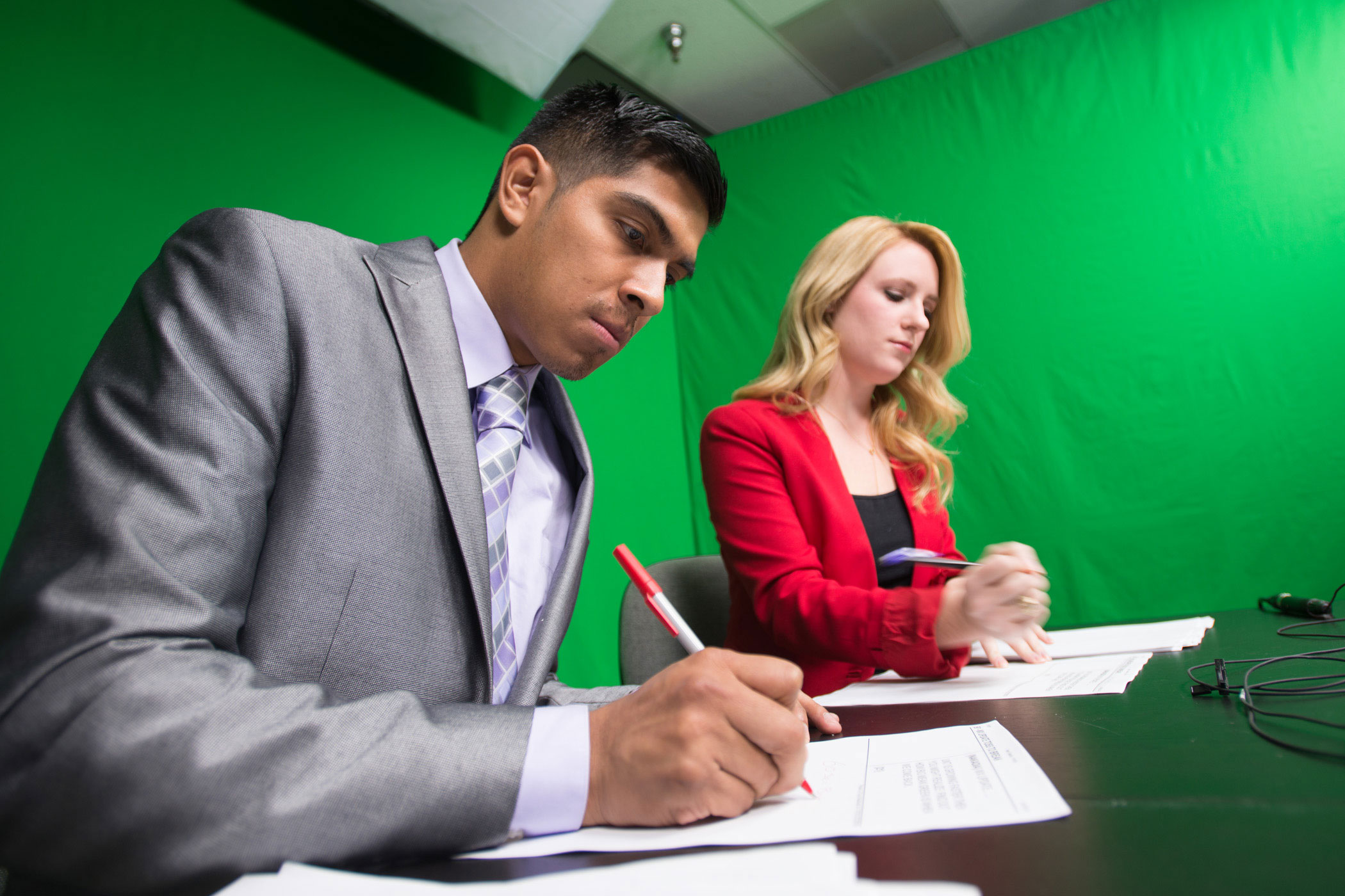 Two students working on a a script.