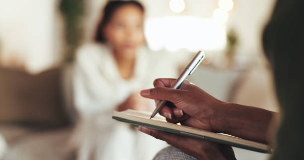 Woman holding journal and pen