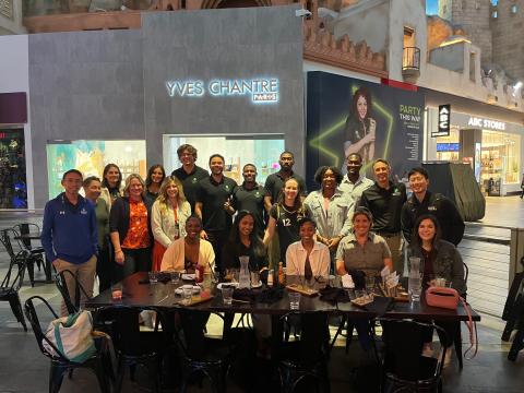 Center faculty and staff seated around a table at the conference